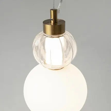 Pendant light with a gold-colored metal base and geometrically structured glass in a modern design – Collar | Maytoni