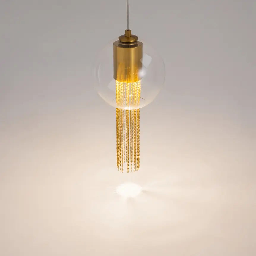 Pendant light with transparent glass shade and decorative bronze chains in an elegant design – Flusso | Maytoni