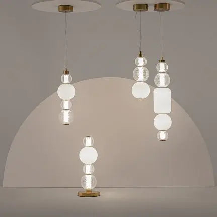 Pendant light with gold-colored metal base, transparent glass, and crystal accents in a luxurious design – Collar | Maytoni