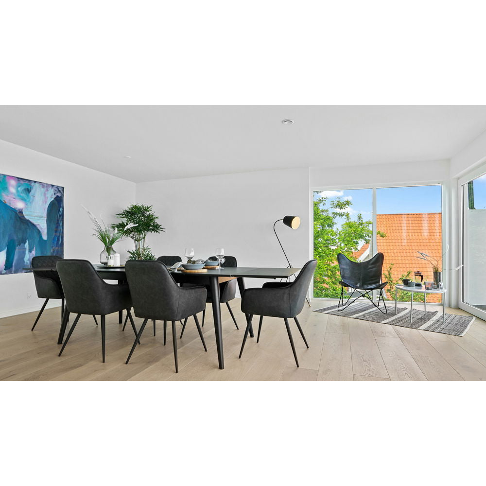 Esszimmerstuhl – Dunkelgraues PU Leder, Schwarzes Metallgestell, Ergonomische Sitzform - Harbo | House Nordic