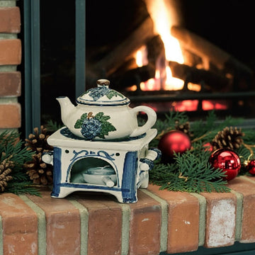 Ceramic oil burner with stove and kettle design, grey-blue colouring and decorative handcrafted character | Wurm