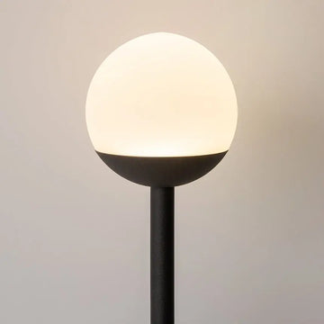 Black metal wall lamp with two white glass spheres and touch dimmer | Maytoni