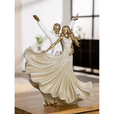 Dekofigur – Goldene Metalloptik, Tanzende Form, Weiße Akzente, Höhe 33,5 cm - Salsa | Gilde