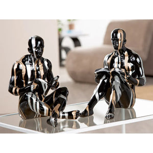 Buchstützen – Personenform, Schwarze Metalloptik, Silberne Linien, Höhe 22,5 cm - Drip | Gilde