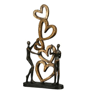 Skulptur – Strukturierte Oberfläche, Bronzene Optik, Goldenes Herz - Herz auf Herz | Gilde