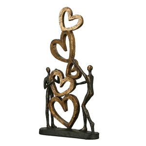 Skulptur – Strukturierte Oberfläche, Bronzene Optik, Goldenes Herz - Herz auf Herz | Gilde