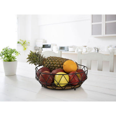 Obstschale aus filigranem Metalldraht mit Mangoholz-Boden, offene Drahtstruktur, luftiges Design – Neo | MVG Voglrieder