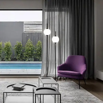 Floor lamp made of metal & glass spheres with ergonomic cross base – The Sixth Sense | Maytoni