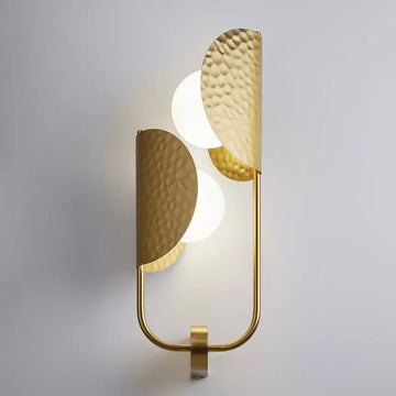 Brass-colored metal wall lamp with embossed tropical leaf motif and two white glass domes – Tropic | Maytoni