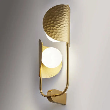 Brass-colored metal wall lamp with embossed tropical leaf motif and two white glass domes – Tropic | Maytoni