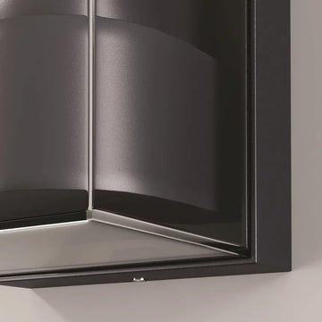 Wall lamp with graphite-colored aluminum housing and clear plastic diffuser – Conf | Maytoni