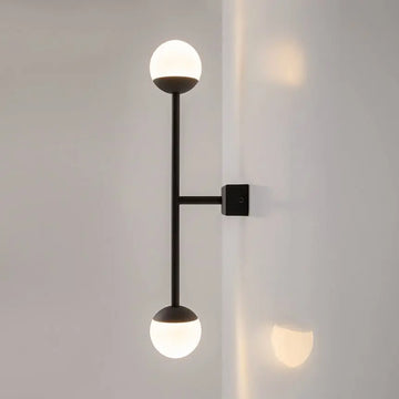 Black metal wall lamp with two white glass spheres and touch dimmer | Maytoni