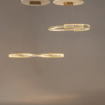 Pendant lamp with brass finish and asymmetrical crystal decoration in a luxurious design – Krone | Maytoni