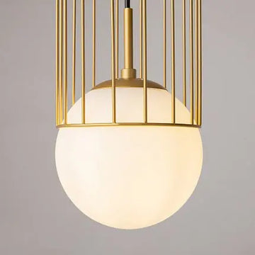 Pendant light with gold-colored metal base and white glass diffuser in a modern design – Telford | Maytoni