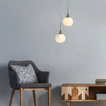 Pendant light with opal glass diffuser and brass finish in a modern design - Erich | Maytoni