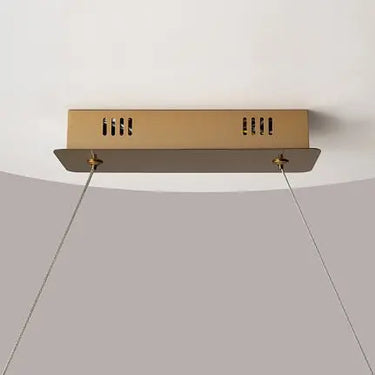 Pendant lamp with brass finish and asymmetrical crystal decoration in a luxurious design – Krone | Maytoni