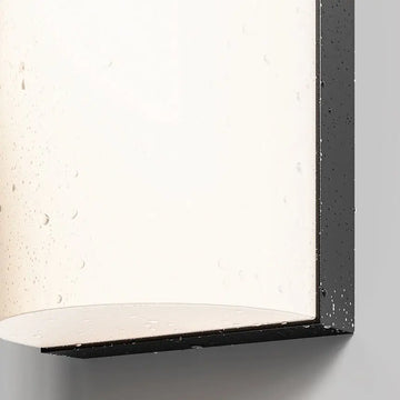Wall light with a graphite-colored aluminum housing and a rounded, matte white diffuser – Badd | Maytoni