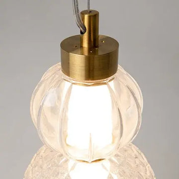 Pendant light with a gold-colored metal base and geometrically structured glass in a modern design – Collar | Maytoni