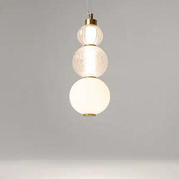 Pendant light with a gold-colored metal base and geometrically structured glass in a modern design – Collar | Maytoni