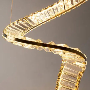 Pendant lamp with brass finish and asymmetrical crystal decoration in a luxurious design – Krone | Maytoni