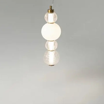 Pendant light with a gold-colored metal base and geometrically structured glass in a modern design – Collar | Maytoni
