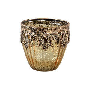 Glass tealight holder with an elegant gold finish, finely textured surface, and atmospheric light reflection – Decoritz | PTMD