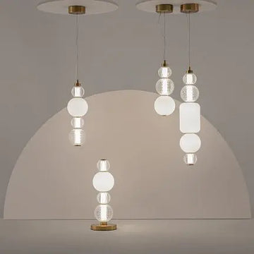 Pendant light with a gold-colored metal base and geometrically structured glass in a modern design – Collar | Maytoni