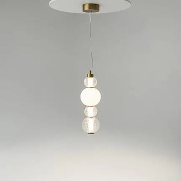 Pendant light with a gold-colored metal base and geometrically structured glass in a modern design – Collar | Maytoni